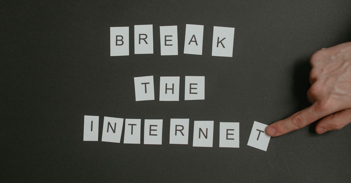 Textual phrase 'Break the Internet' arranged on a black background with a pointing hand.